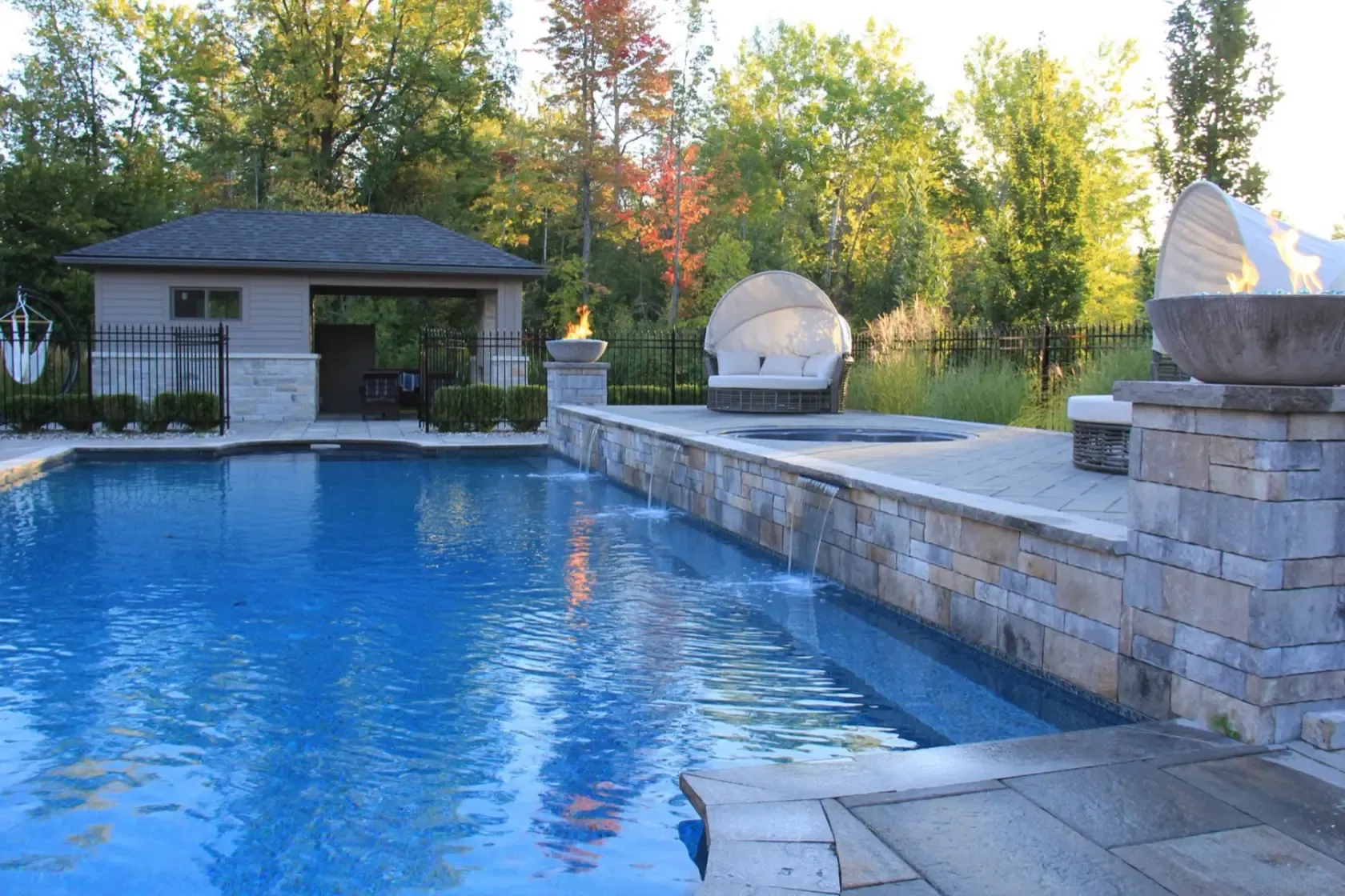 Osmond Daly Estate pool, stone terraces and fire bowls